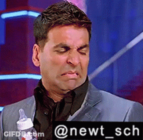 Man In Suit Holding Baby Bottle @Newt_sch GIF