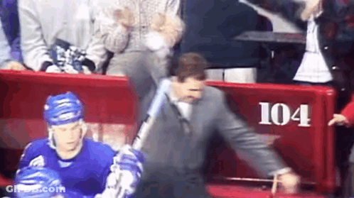Man In Suit Holding Baseball Bat By Red Bench 104 GIF