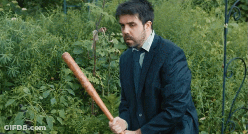 Man In Suit Holding Baseball Bat GIF