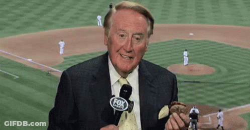 Man In Suit Holding Baseball In Front Of Fox Sports Logo GIF