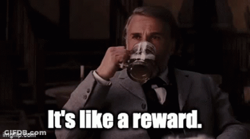 Man In Suit Holding Beer Says It's Like A Reward GIF