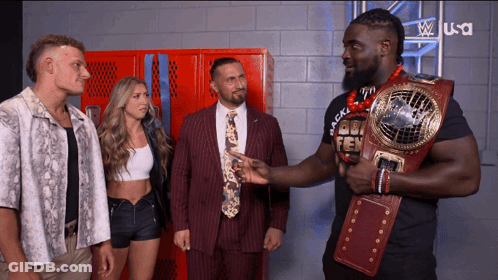 Man In Suit Holding Belt Saying Gold GIF