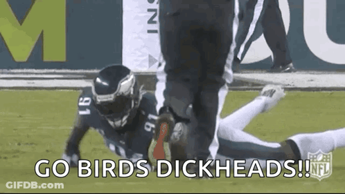 Man In Suit Holding Book With Jaguars Logo GIF