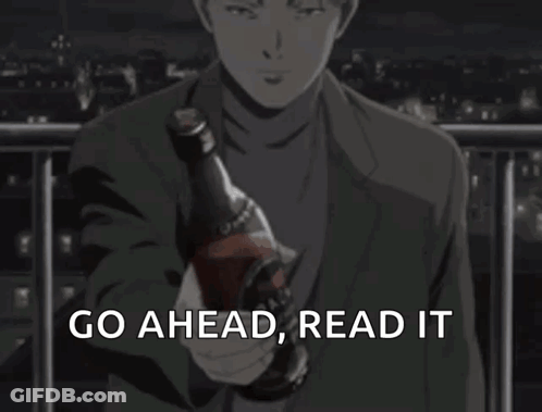 Man In Suit Holding Bottle Saying Go Ahead Read It GIF