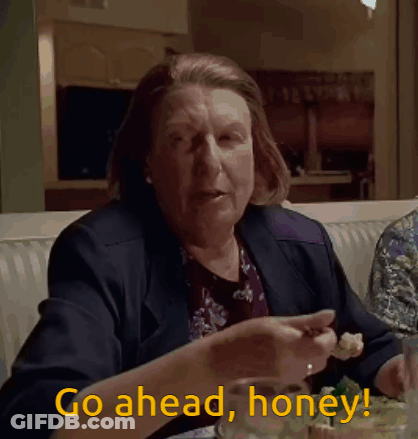 Man In Suit Holding Bottle Saying Go Ahead Read It GIF
