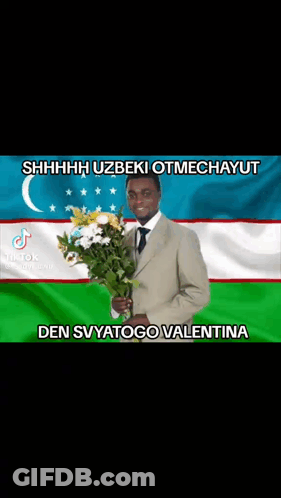 Man In Suit Holding Bouquet Of Flowers GIF