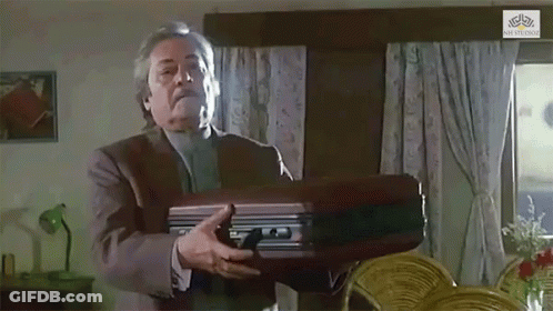Man In Suit Holding Briefcase GIF