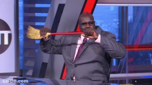 Man In Suit Holding Broom GIF