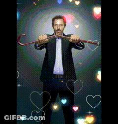 Man In Suit Holding Cane With Hearts GIF