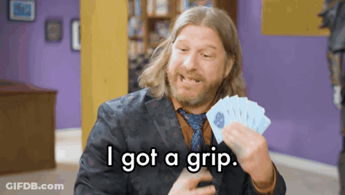 Man In Suit Holding Cards Saying I Got A Grip GIF