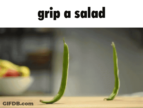 Man In Suit Holding Cards Saying I Got A Grip GIF