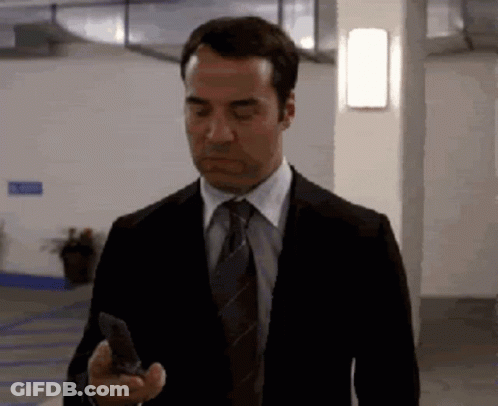 Man In Suit Holding Cell Phone GIF