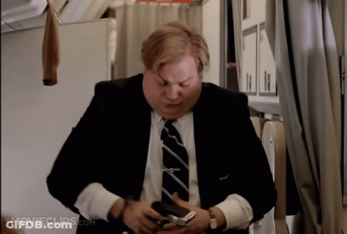 Man In Suit Holding Cell Phone Movieclips Logo GIF