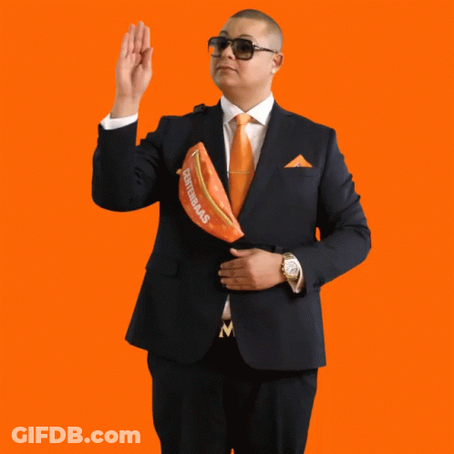 Man In Suit Holding Centennials Fanny Pack GIF