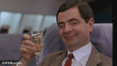 Man In Suit Holding Champagne GIF
