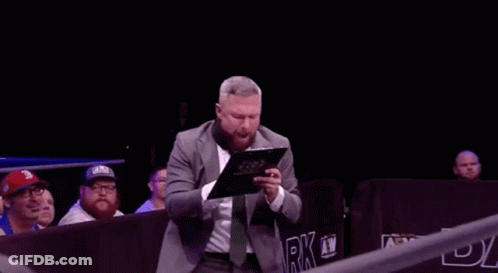 Man In Suit Holding Clipboard GIF