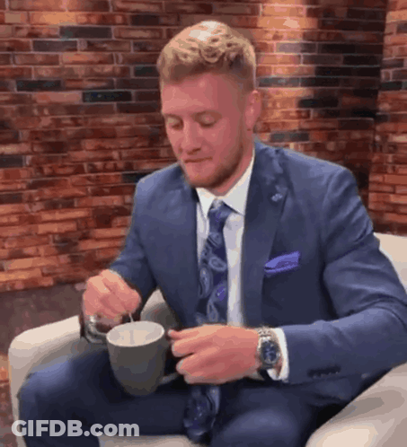 Man In Suit Holding Coffee GIF