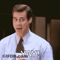 Man In Suit Holding Coffee Saying Yay GIF