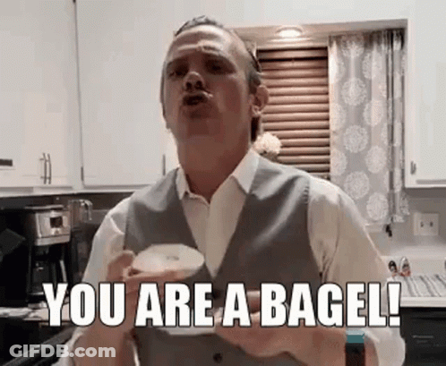 Man In Suit Holding Coffee Saying You Are A Bagel GIF