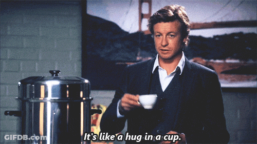 Man In Suit Holding Coffee Says It's Like A Hug In A Cup GIF