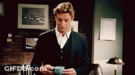 Man In Suit Holding Coffee GIF
