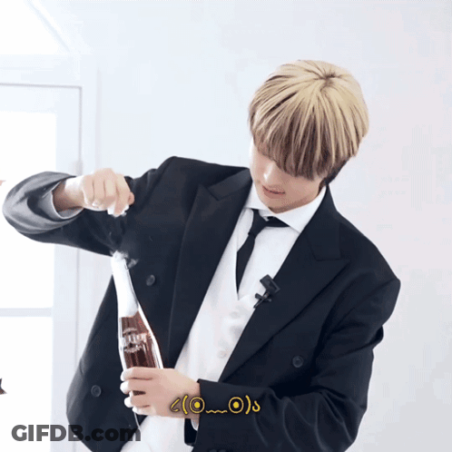 Man In Suit Holding Coke GIF