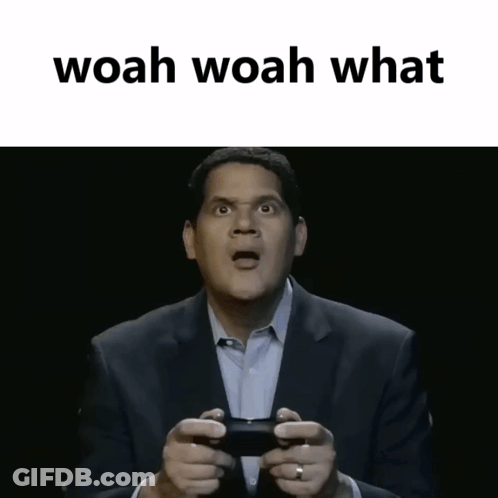 Man In Suit Holding Controller Saying Woah Woah What GIF