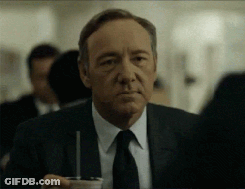Man In Suit Holding Cup With Straw GIF