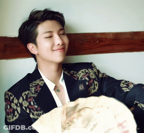 Man In Suit Holding Fan GIF