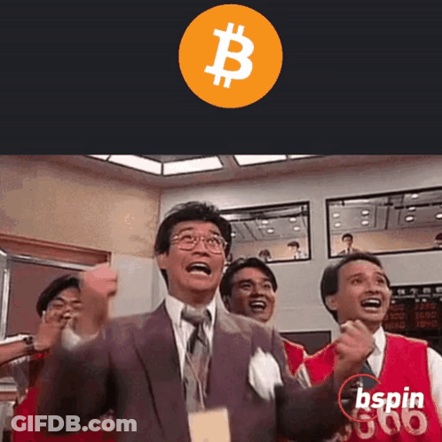 Man In Suit Holding Fist In Air In Front Of Bspin Sign GIF