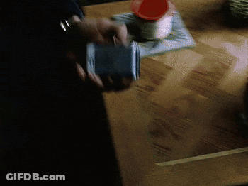 Man In Suit Holding Flip Phone Saying Found It GIF