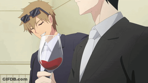 Man In Suit Holding Glass Of Red Wine GIF