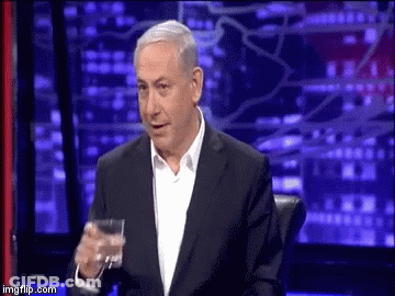 Man In Suit Holding Glass Of Water GIF