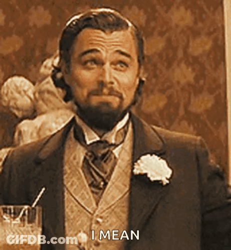 Man In Suit Holding Glass GIF