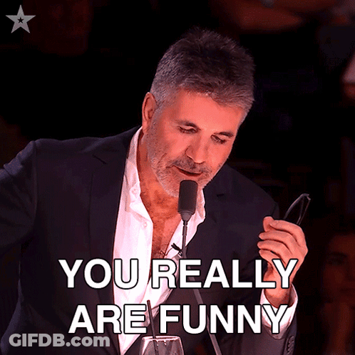 Man In Suit Holding Glasses Says You Really Are Funny GIF