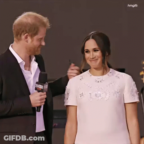 Man In Suit Holding Global Citizen Microphone GIF