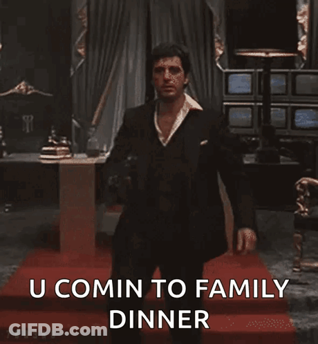 Man In Suit Holding Gun GIF
