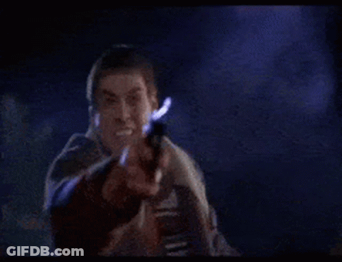 Man In Suit Holding Gun And Screaming GIF