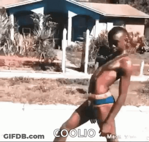 Man In Suit Holding Gun GIF