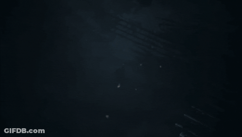 Man In Suit Holding Gun GIF