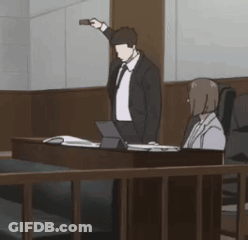 Man In Suit Holding Gun In Courtroom GIF