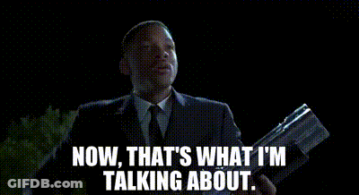 Man In Suit Holding Gun Saying Now That's What I'm Talking About GIF