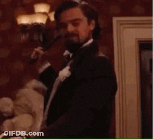 Man In Suit Holding Gun Saying Sold GIF