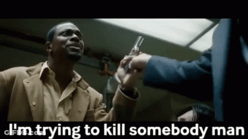 Man In Suit Holding Gun Says I'm Trying To Kill Somebody GIF