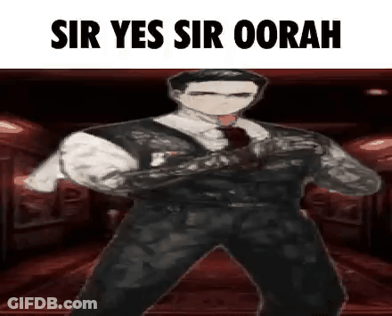 Man In Suit Holding Gun GIF