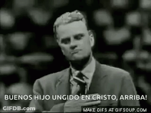 Man In Suit Holding Hand To Chest GIF