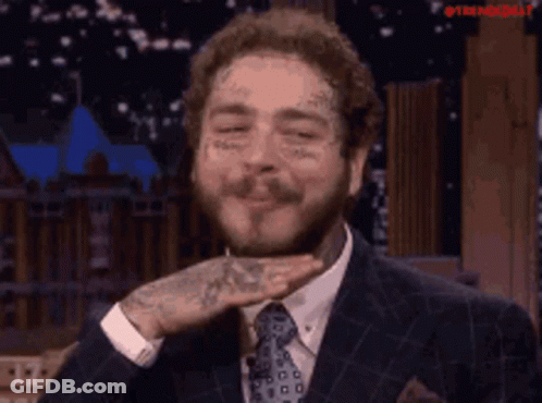 Man In Suit Holding Hand To Face GIF
