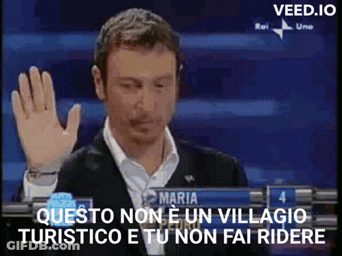 Man In Suit Holding Hand Up In Front Of Maria Sign GIF
