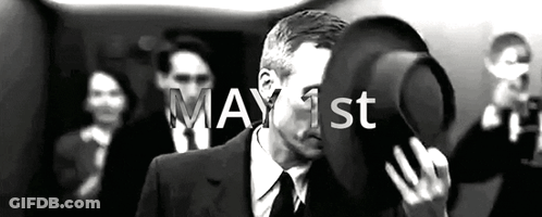 Man In Suit Holding Hat GIF