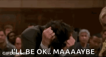 Man In Suit Holding Head GIF